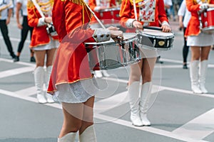 Young girls drummer at the parade. Street performance. Majorettes in the parade