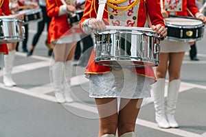 Young girls drummer at the parade. Street performance. Majorettes in the parade