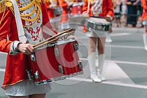 Young girls drummer at the parade. Street performance. Majorettes in the parade photo