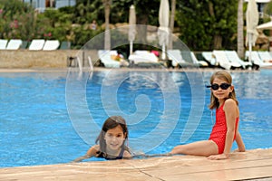 Young girls at edge of pool