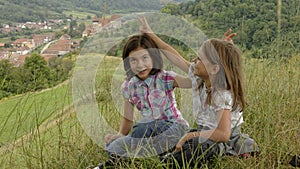 Young girls fooling around, Copsa Mare, Romania