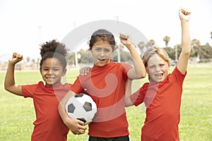 Young Girls In Football Team Celebrating