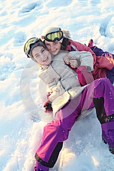 Young girls have fun on a winter sunny day