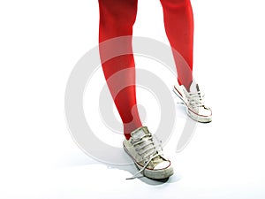 Young girls legs in red tights and old sneakers