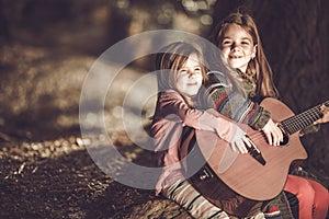 Young Girls Playing Guitar