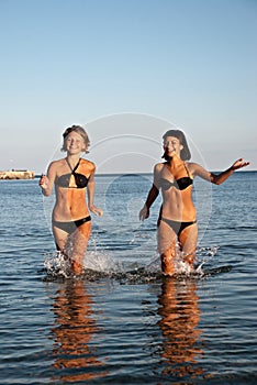 Young girls running on water