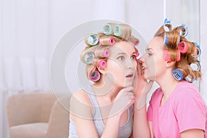Young girls sharing secrets