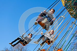 Young girls on the swing carousel