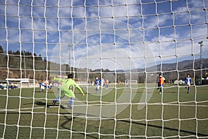 Young Goalkeeper in action during a football match