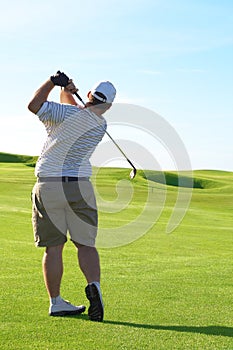 Young golfer on the fairway