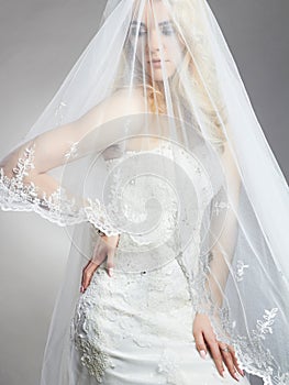 Young gorgeous bride woman with veil