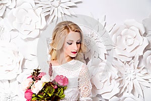 Young gorgeous woman, bride, blond long curly hair, studio decor