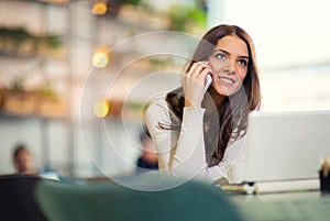 Young gorgeous woman having smart phone conversation