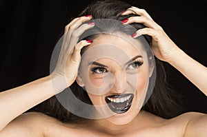 Young gothic desperate woman with red nails