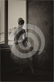 Young and graceful ballerina in pointe shoes and a tutu dances in the studio. Choreography and dancing classes concept.