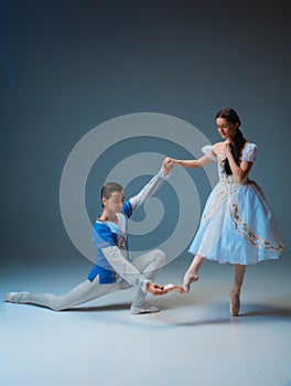 Young and graceful ballet dancers as Cinderella fairytail characters. photo