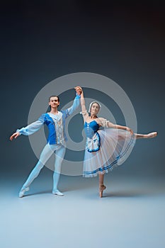 Young and graceful ballet dancers as Cinderella fairytail characters. photo