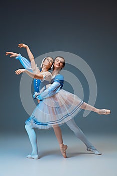 Young and graceful ballet dancers as Cinderella fairytail characters. photo