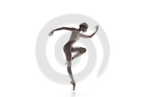 Ballerina. Young graceful female ballet dancer dancing isolated on white. Beauty of classic ballet.