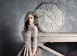 Young and graceful woman posing in ancient interior