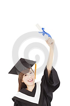 Young graduate girl student holding diploma and hand up