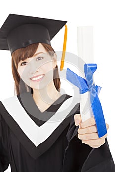 Young graduate girl student holding and showing diploma