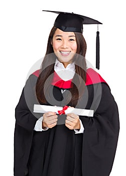 Young graduate girl student holding and showing diploma