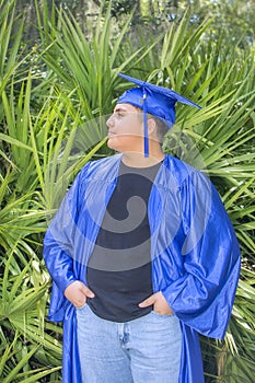 Young Graduate Proudly Displaying Cap And Gown