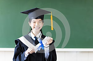 Young graduation student in her classroom