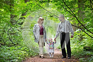 Young grandparents hiking with their baby grand daughter