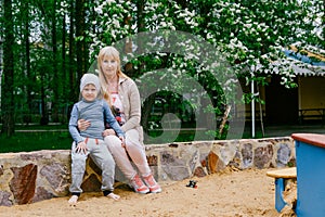 Young Granny hugs grandson