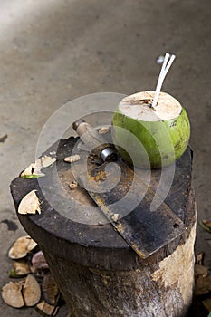 Young green coconut fruit with top chopped off