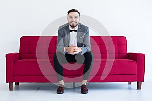 Young groom with bearded standing and smiling in formal tuxedo and suit in wedding day on white background,Copy space for text