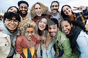 Young group of happy multiracial people having fun together outdoor