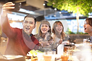 Young Group taking selfie in the restaurant