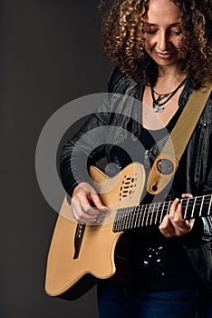 Young Guitar player woman