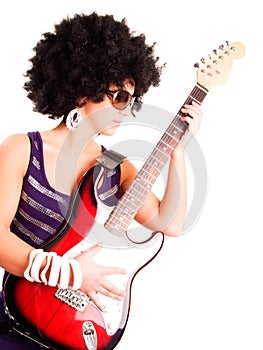 Young guitarist girl holding guitar over white
