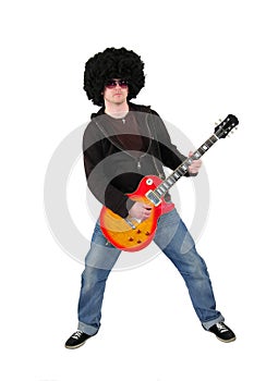 Young guitarist with a wig and sunglasses