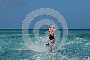 Young Guy In Aruba Riding on a Wakeboard