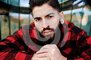 Young guy with beard and piercings photo