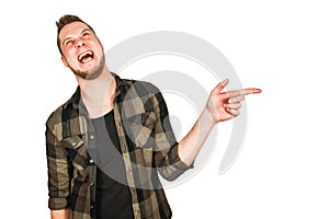 Young guy with beard taunts and shows finger up isolated on white background