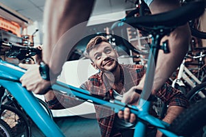 Young Guy Bring Bicycle to Repair in Workshop