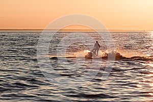 Young guy cruising in the baltic sea on a jet ski