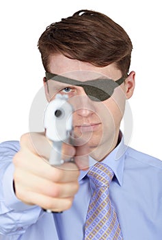 Young guy with eye-patch shooting a pistol