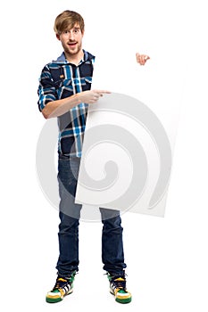 Young guy holding blank poster