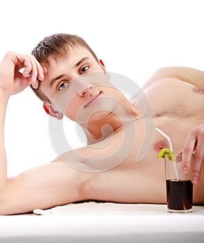 Young guy lie with glass in hand