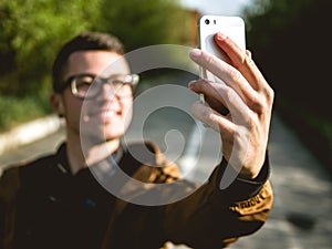 The young guy making selfie
