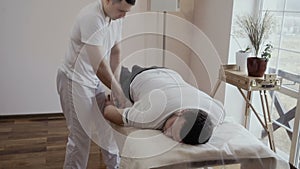 Young guy at the masseur`s reception