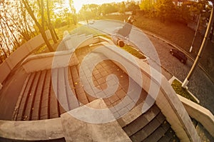 A young guy performs a side flip in the autumn park