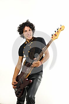 Young guy playing bass guitar